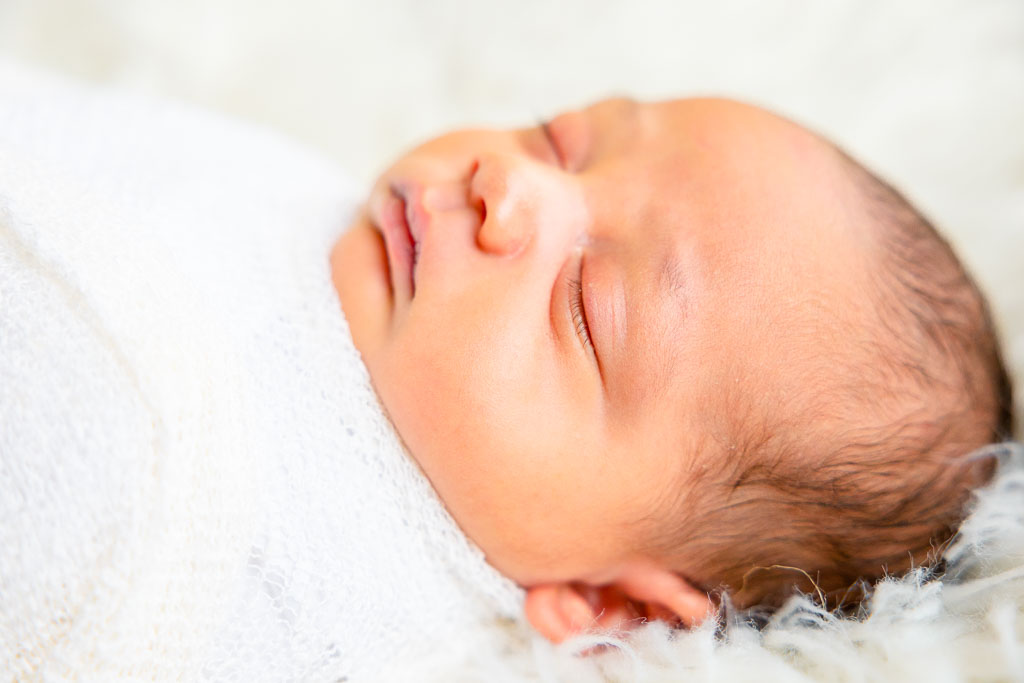 middle georgia newborn photographer. Newborn photo shoot sleeping in wrap
